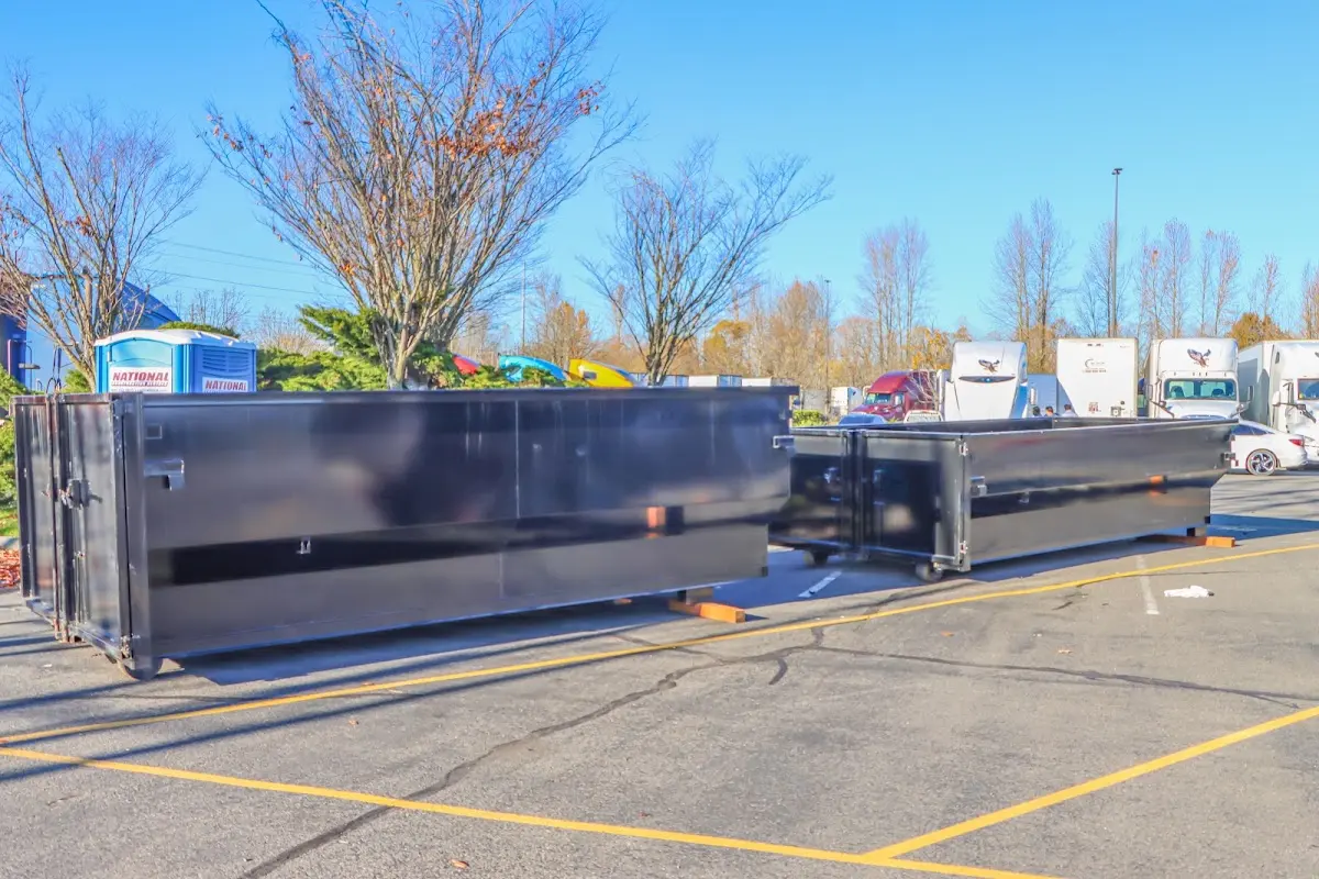 Professional dumpster rental service with roll-off container on residential driveway in Spotsylvania Courthouse